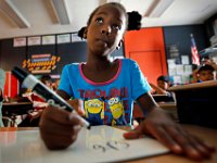 Bianca Lebrun works on her array's and skip counting using a white board in Julie Bosworth's 3rd grade class at the Hayden McFadden Elementary School in New Bedford.   PETER PEREIRA/THE STANDARD-TIMES/SCMG